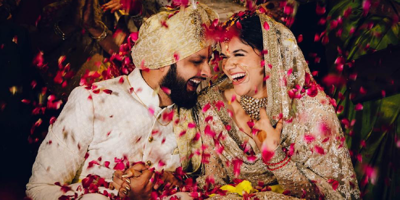 Image That Shows A Beautiful Wedding Couple Smiling with each other in a nature background.